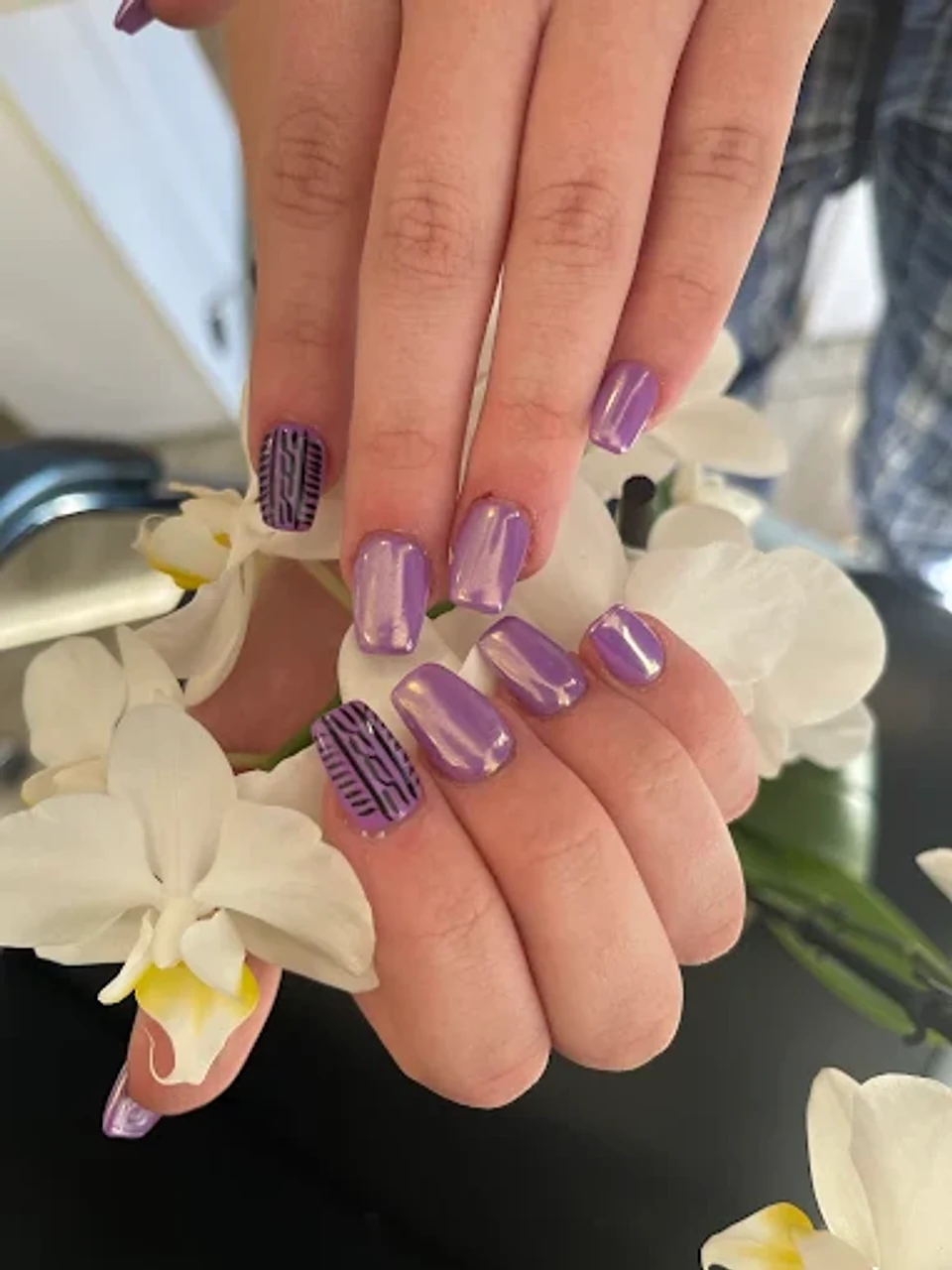 Lavender chrome nails with detailed accents