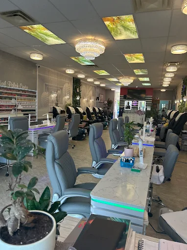 MY Nails & Spa interior showing manicure stations, pedicure chairs, and crystal chandeliers